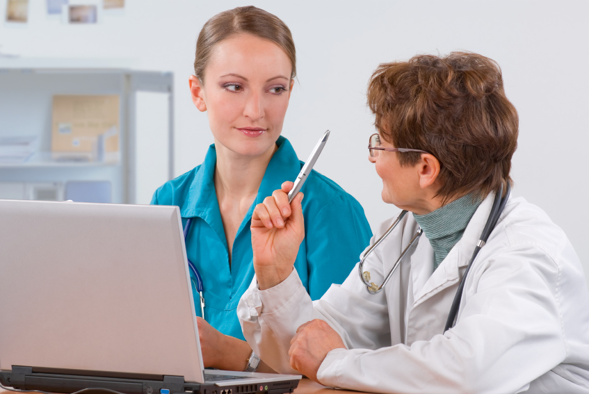 A doctor teaches a student
